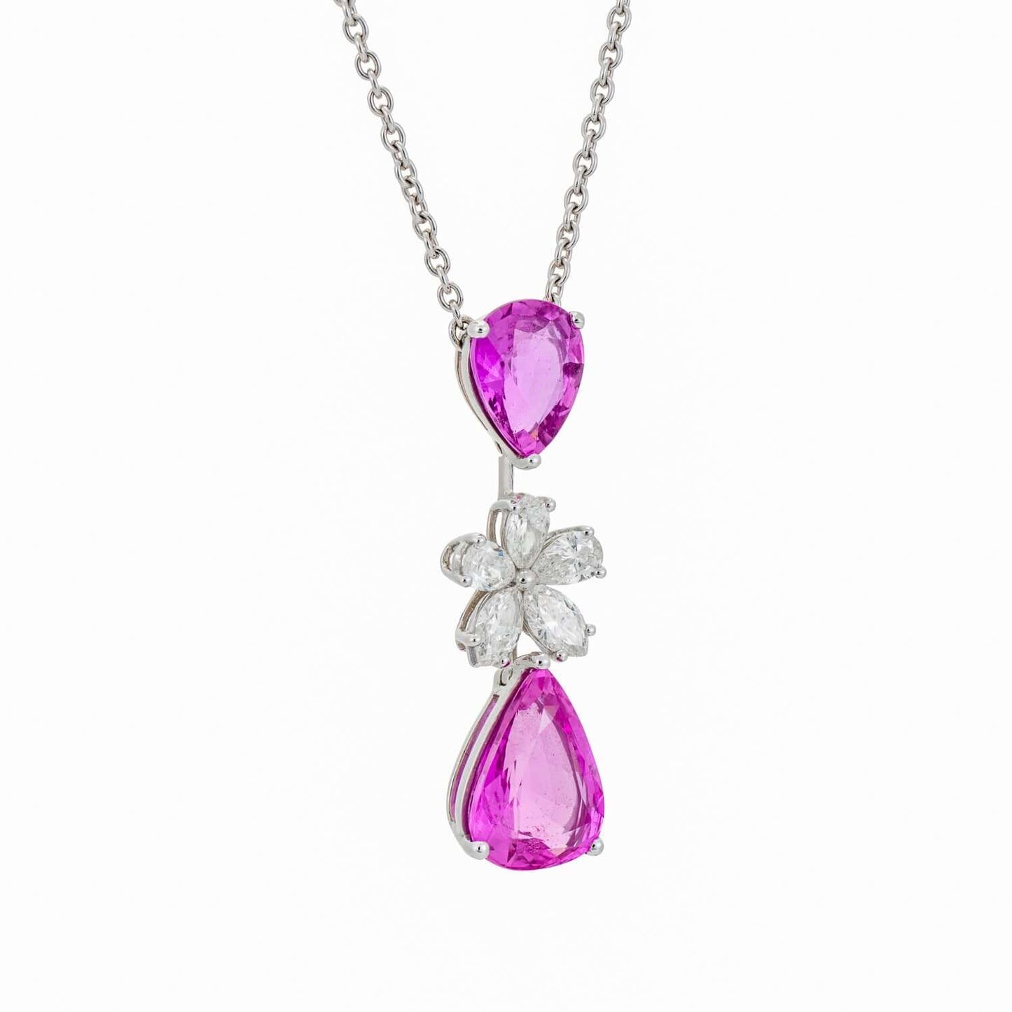 Graff Pink Sapphire and Diamond Flower Motif Drop Necklace featuring pink pearshape sapphires and marquise diamonds on a silver chain.