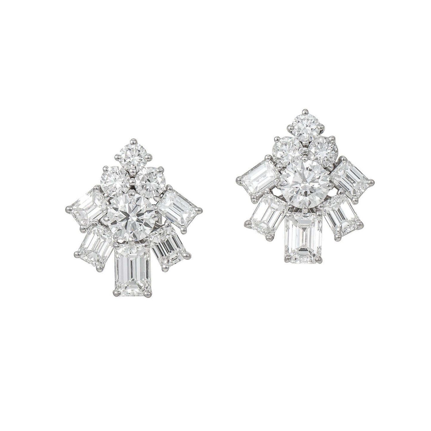 Graff white gold and platinum earrings with 4.64ct emerald cut and round diamonds showcasing luxurious and timeless design.